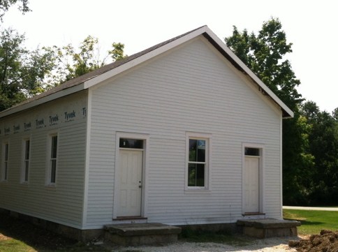 Stewart School front doors (one for the boys and one for the girls), front steps, siding, and new roof.
