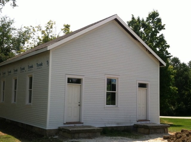 Stewart School front doors (one for the boys and one for the girls), front steps, siding, and new roof.